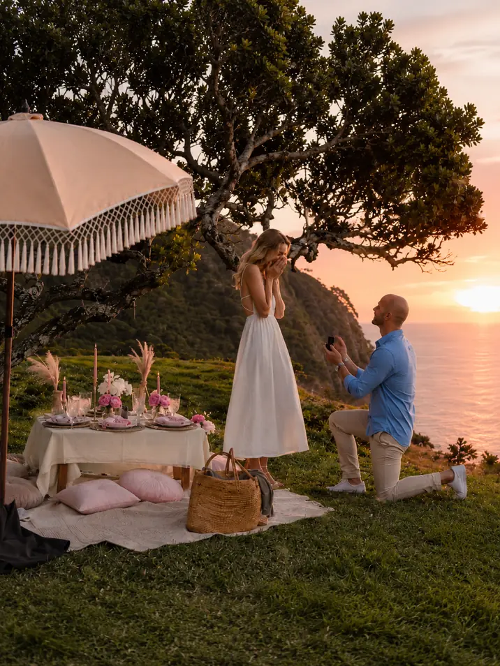 Marriage proposal at a sunset picnic overlooking the Madeira coastline